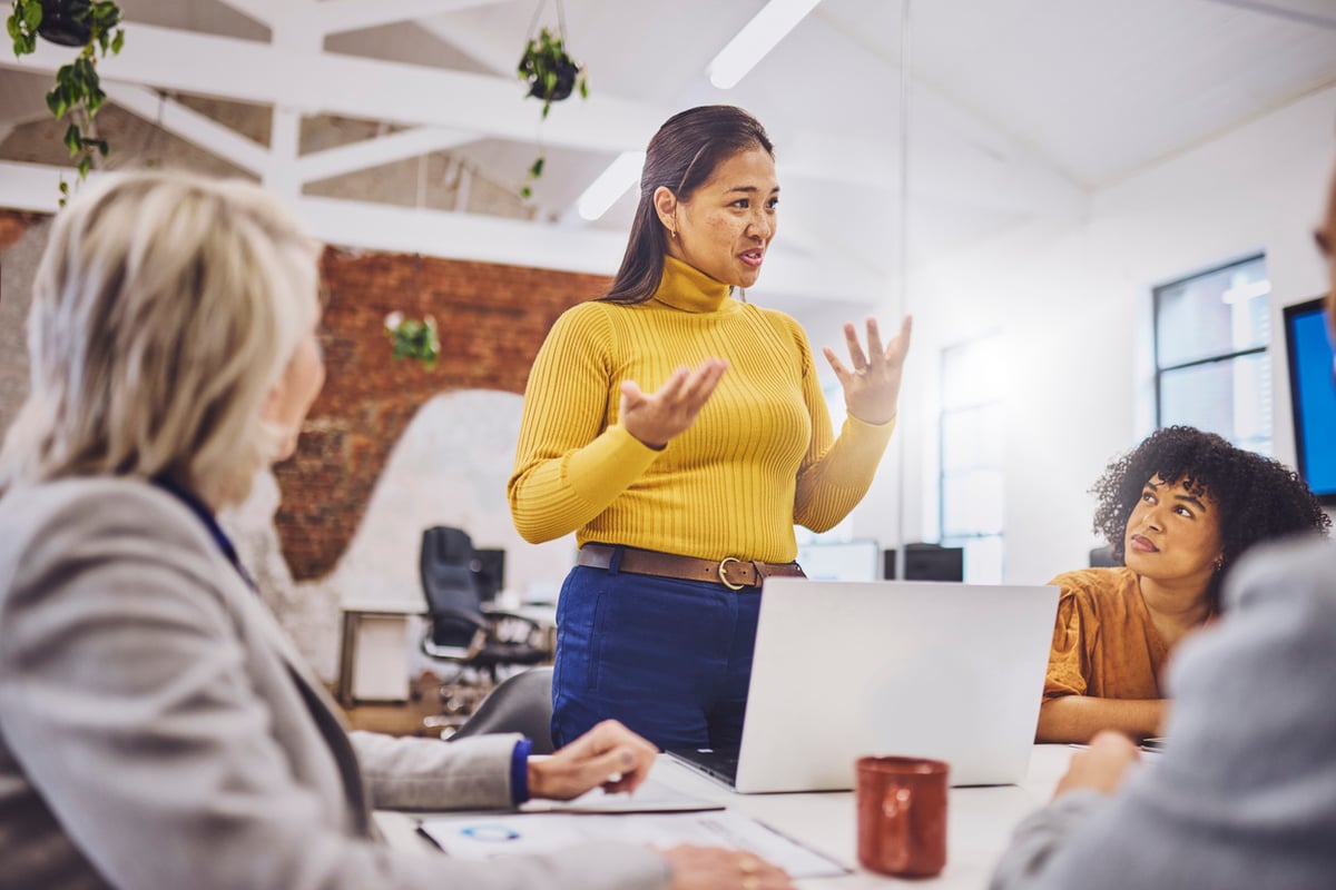 business woman in a meeting explaining concept