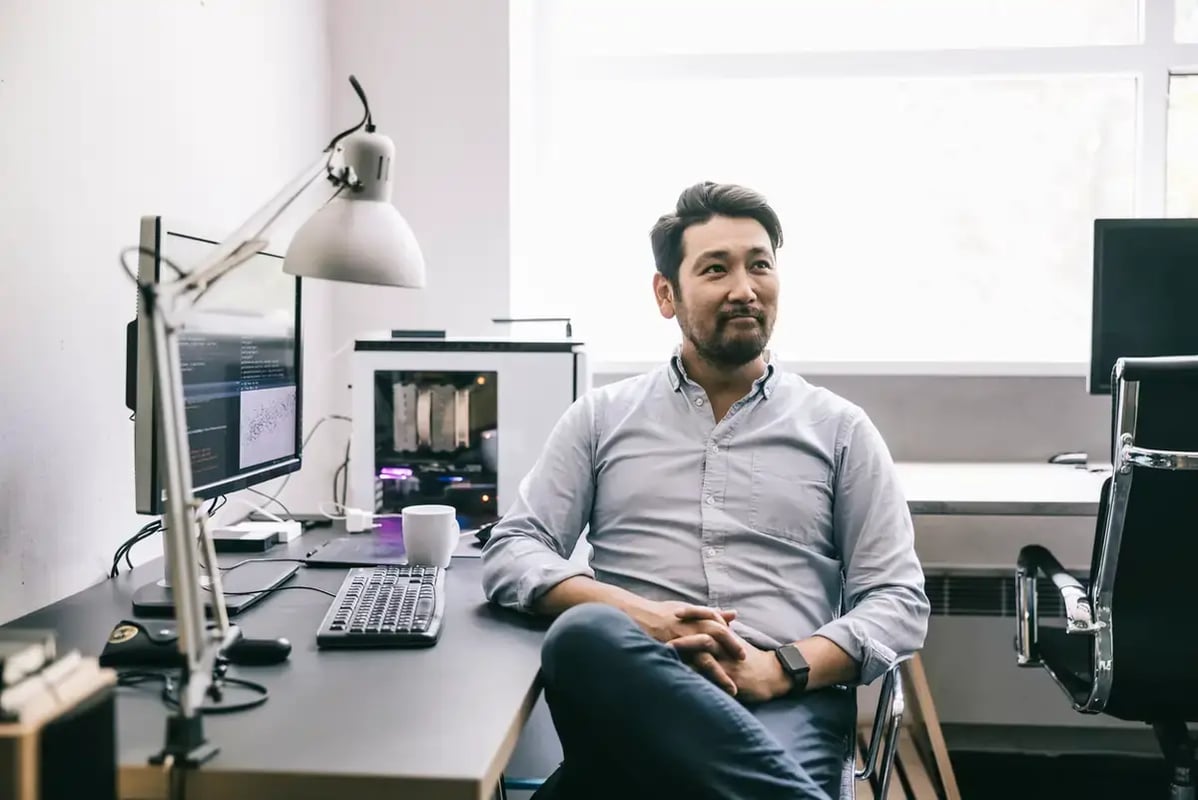 computer programmer working at his desk