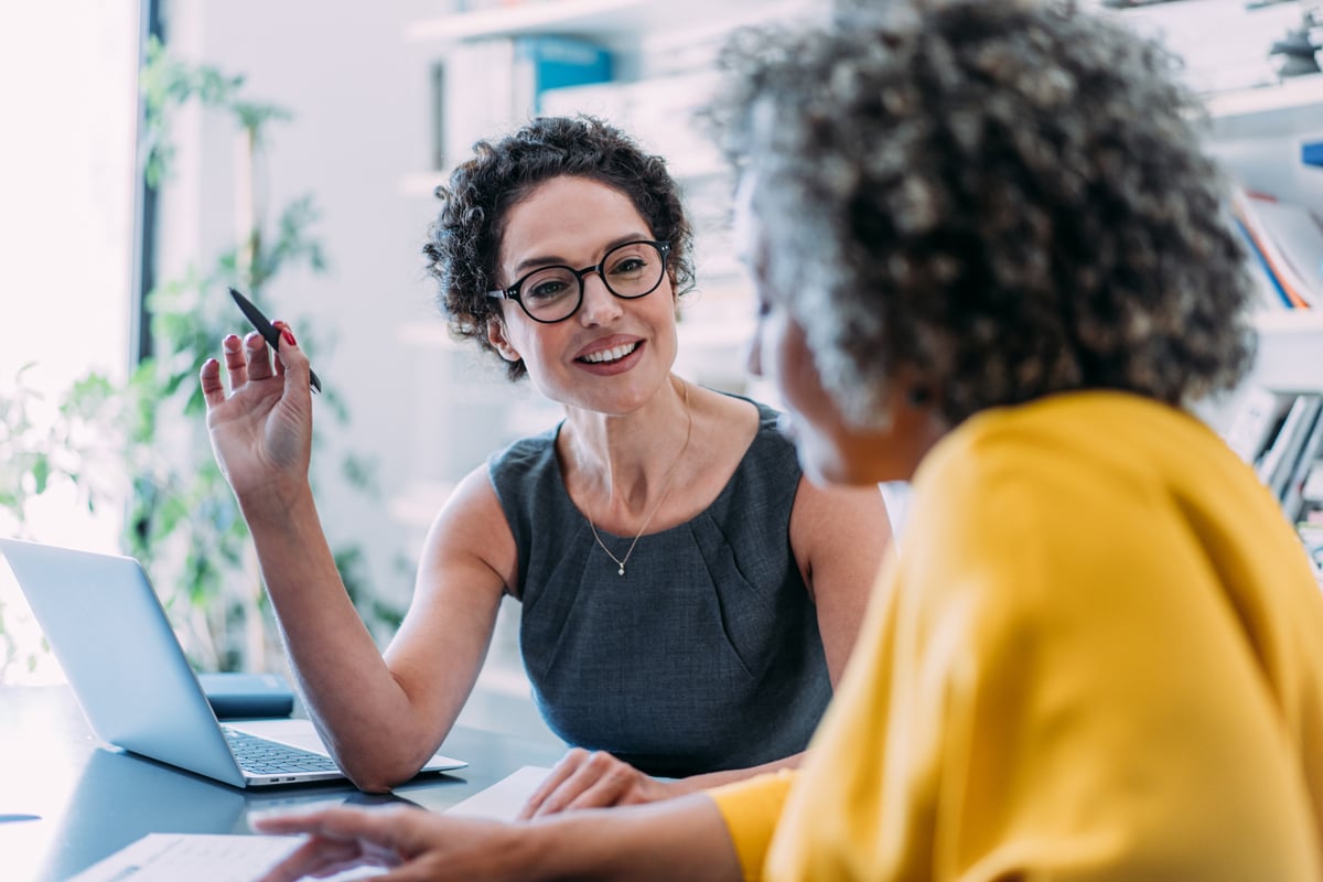 women discussing business