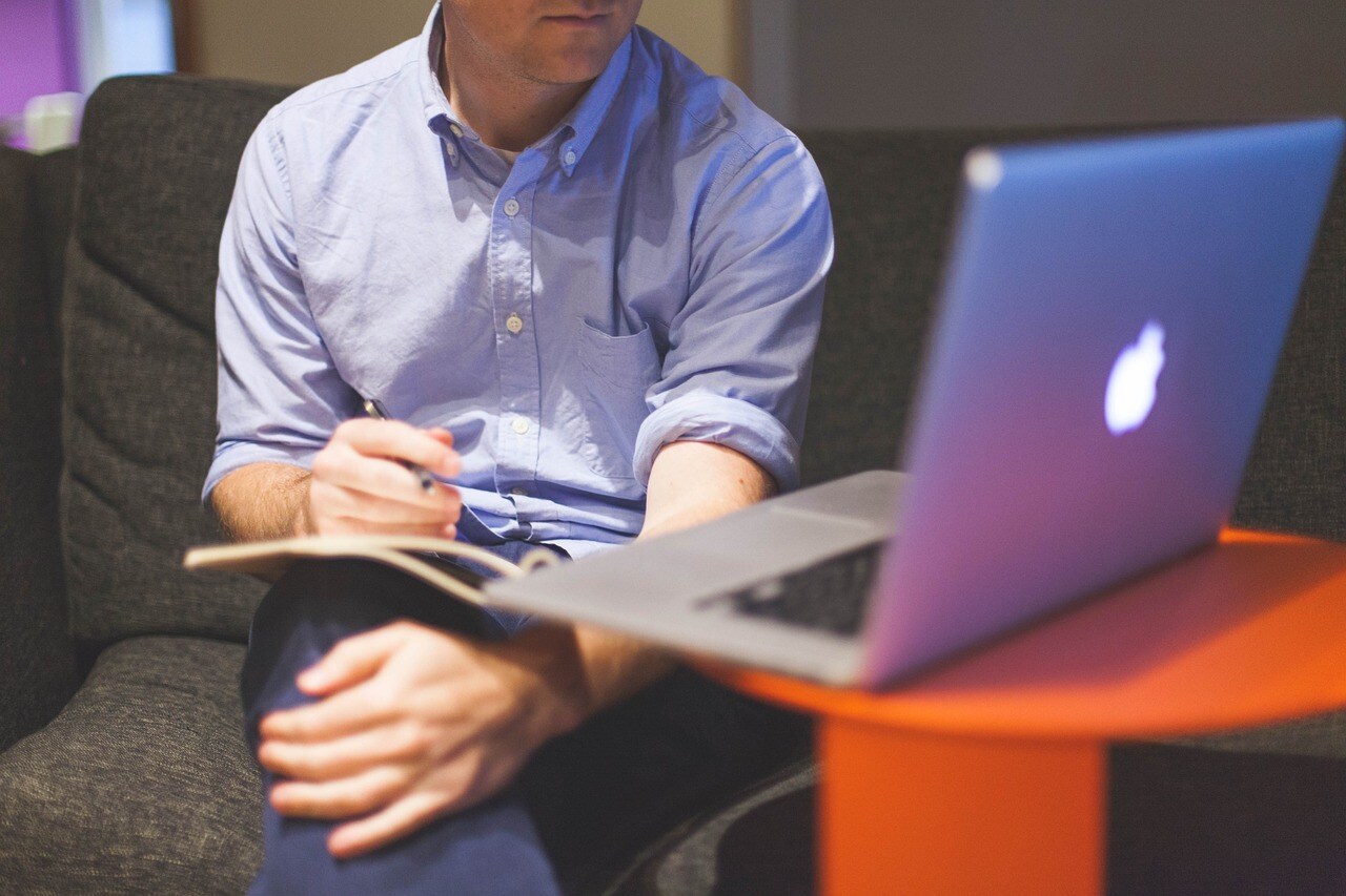 business person looking at MacBook