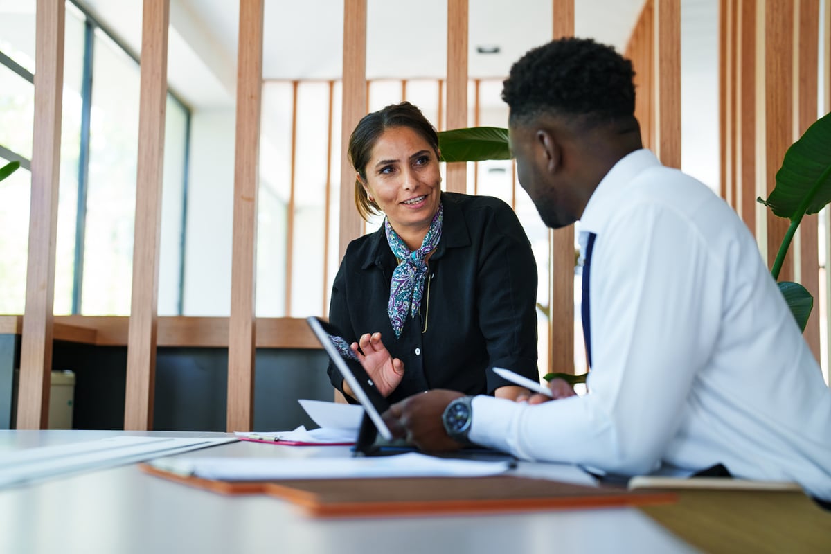 two people working together on a workforce integration plan