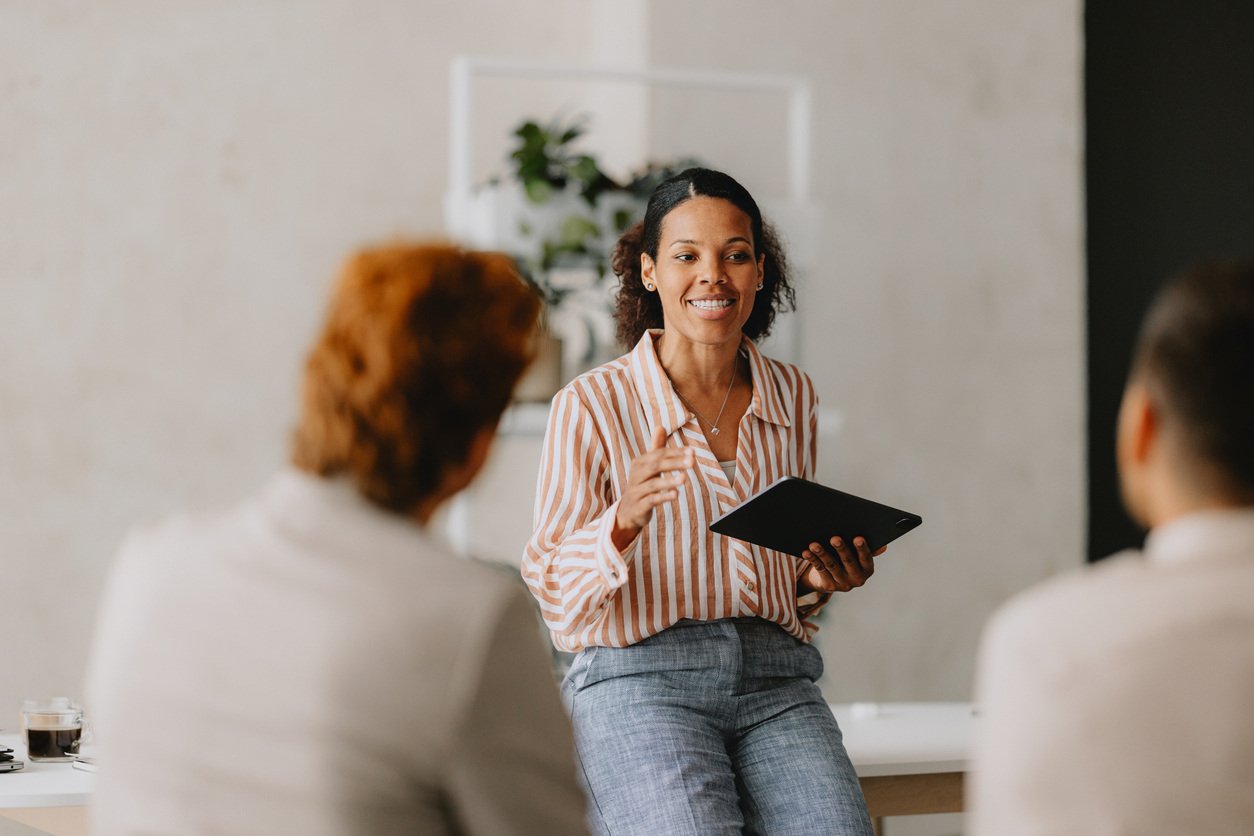 businesswoman leading a business meeting