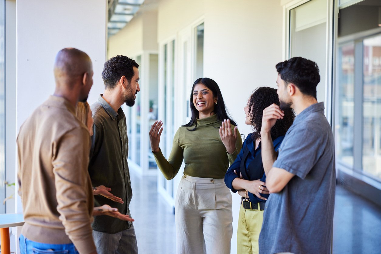 employees talking and listening to a manager