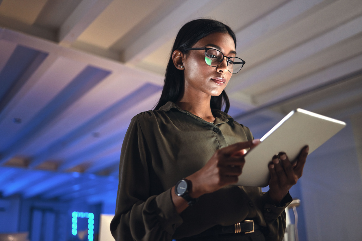 business woman studying analytics on her ipad