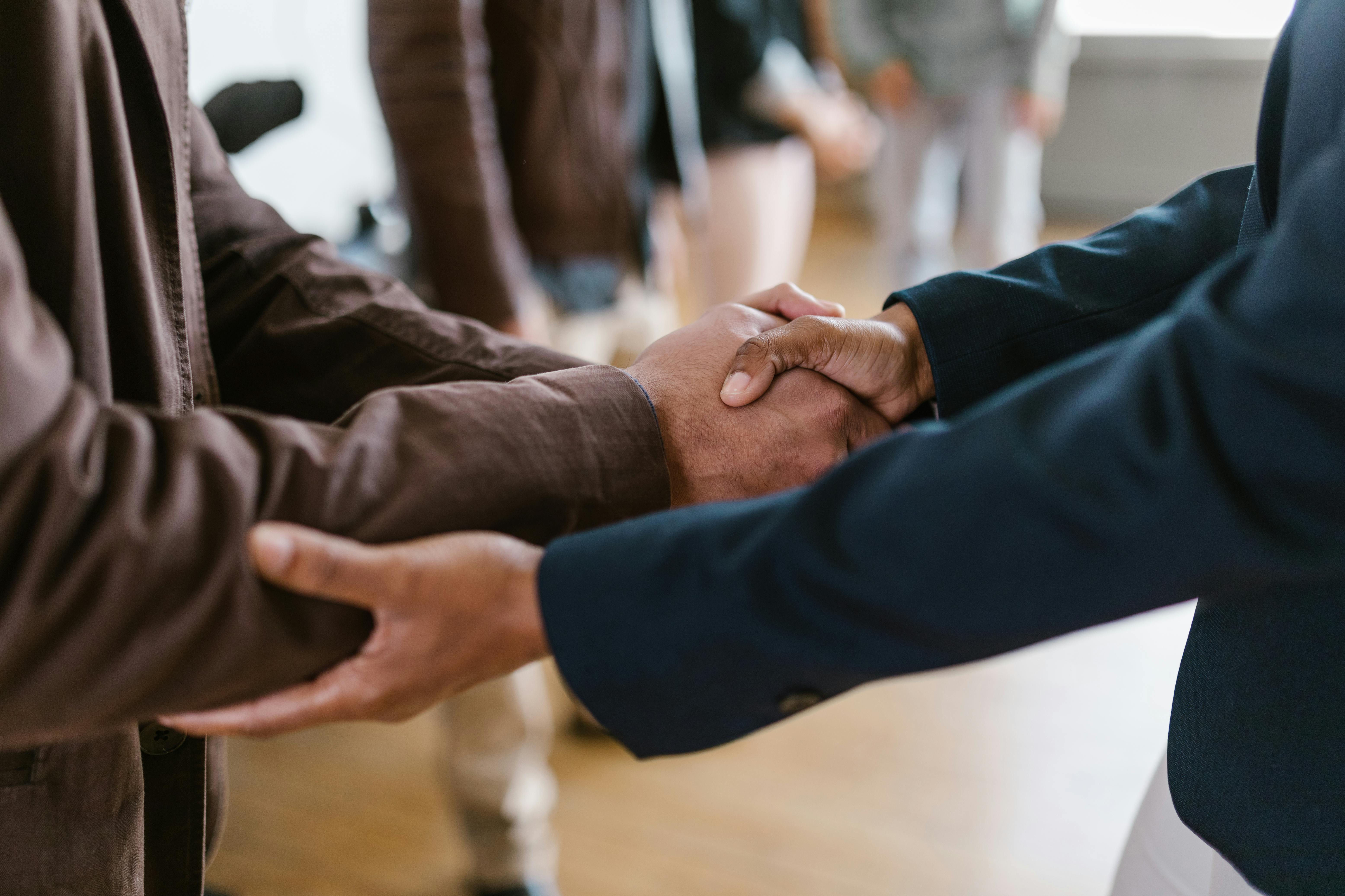 shaking hands in business