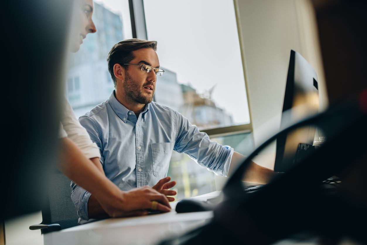 working colleagues discuss figures